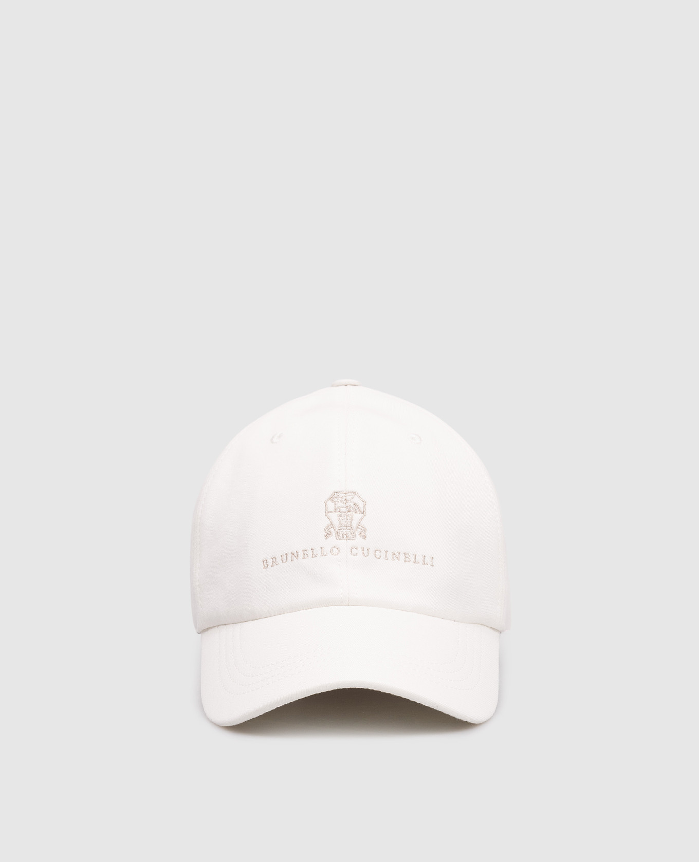White cap with embroidered emblem