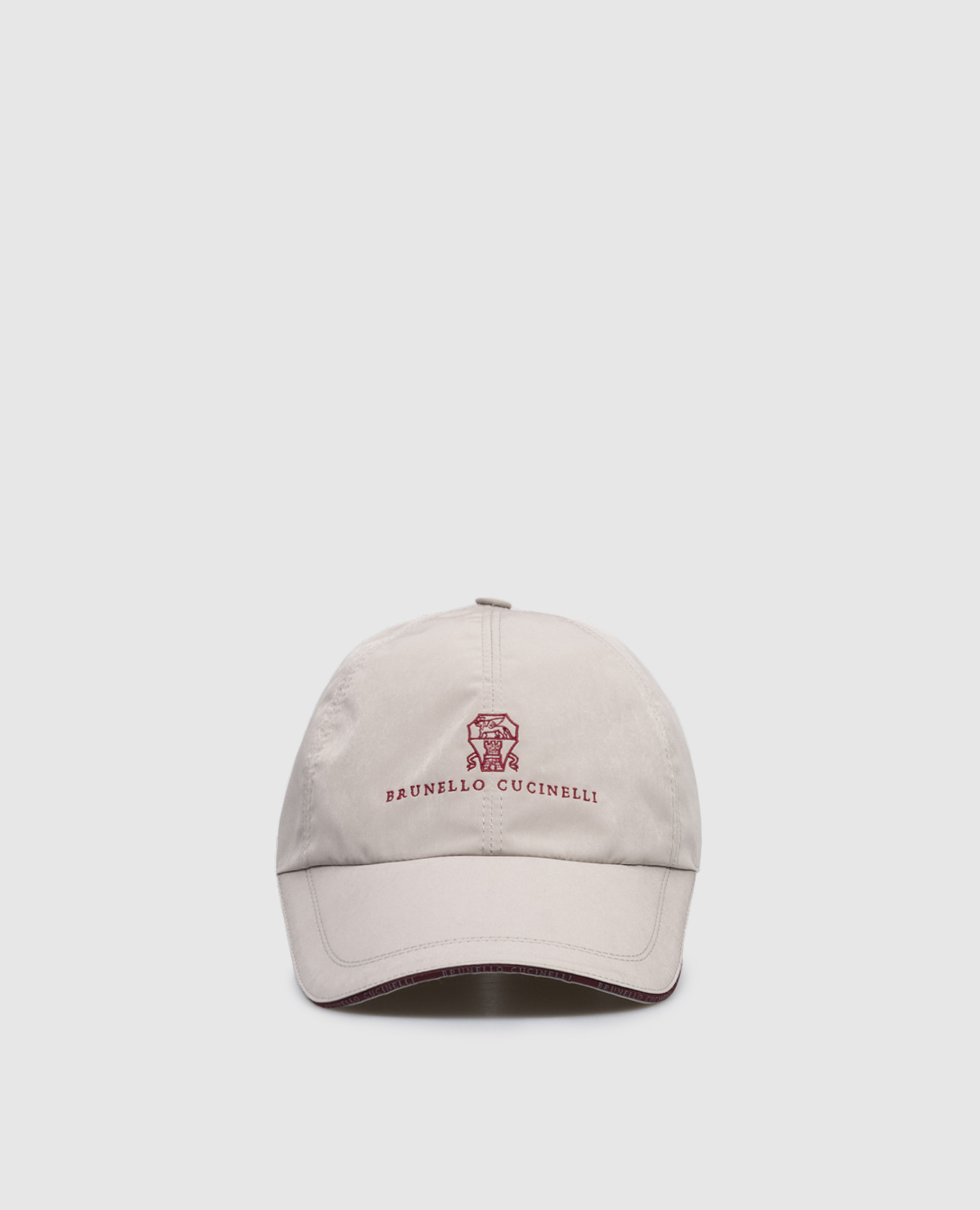 Beige cap with embroidered emblem