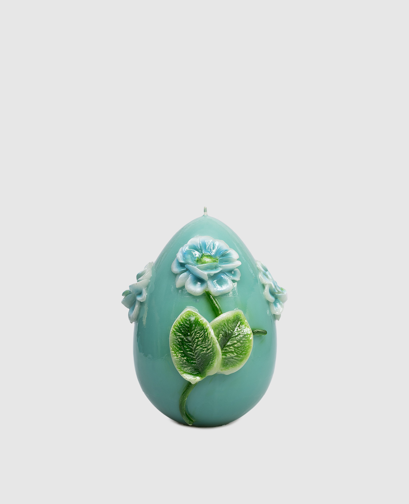 

Green egg-shaped candle with peony Cereria Introna