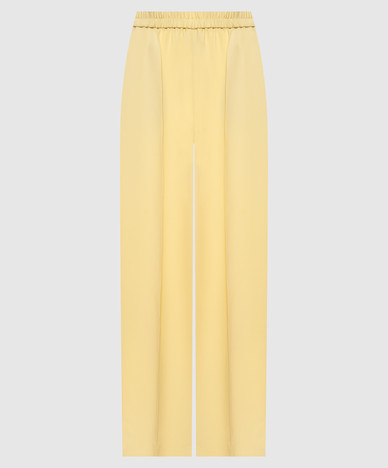 Yellow pants with a monil chain