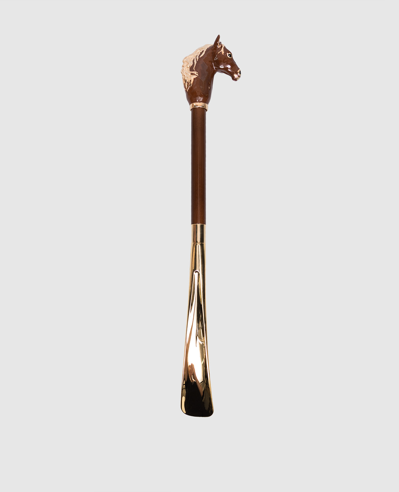 Brown horn with a horse-shaped handle