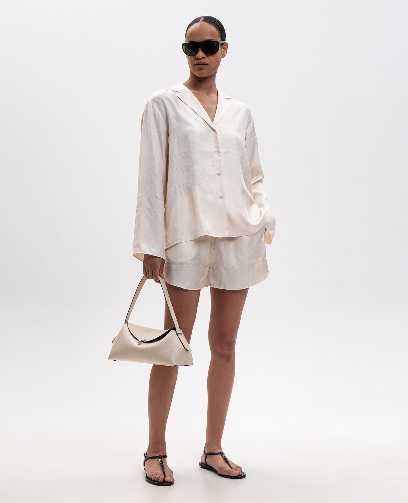 

Beige silk blouse with monogram embroidery Toteme