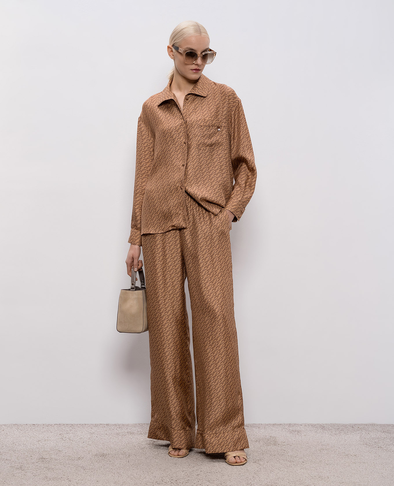 

Brown silk pants with branded print Herno