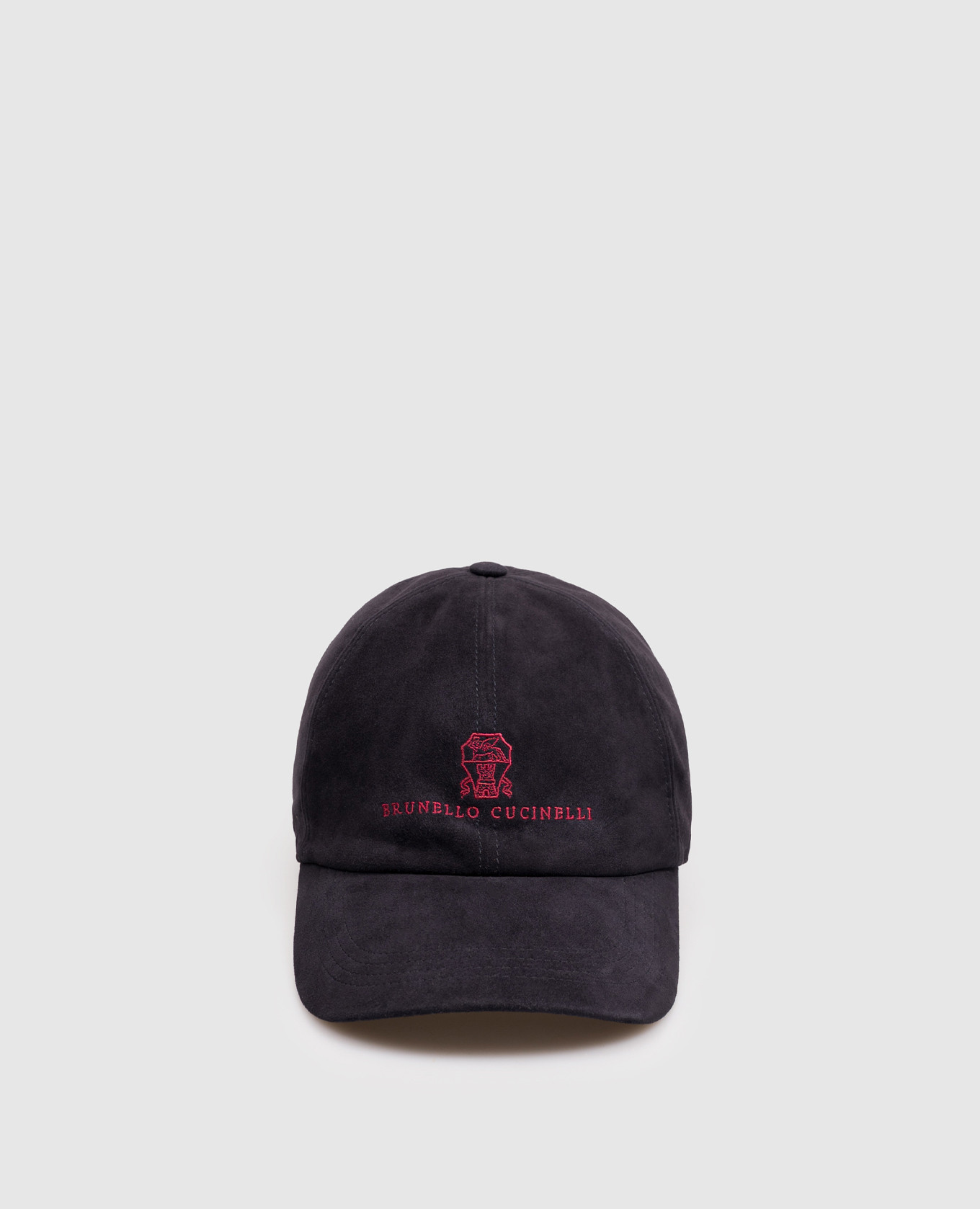 Blue suede cap with embroidered emblem