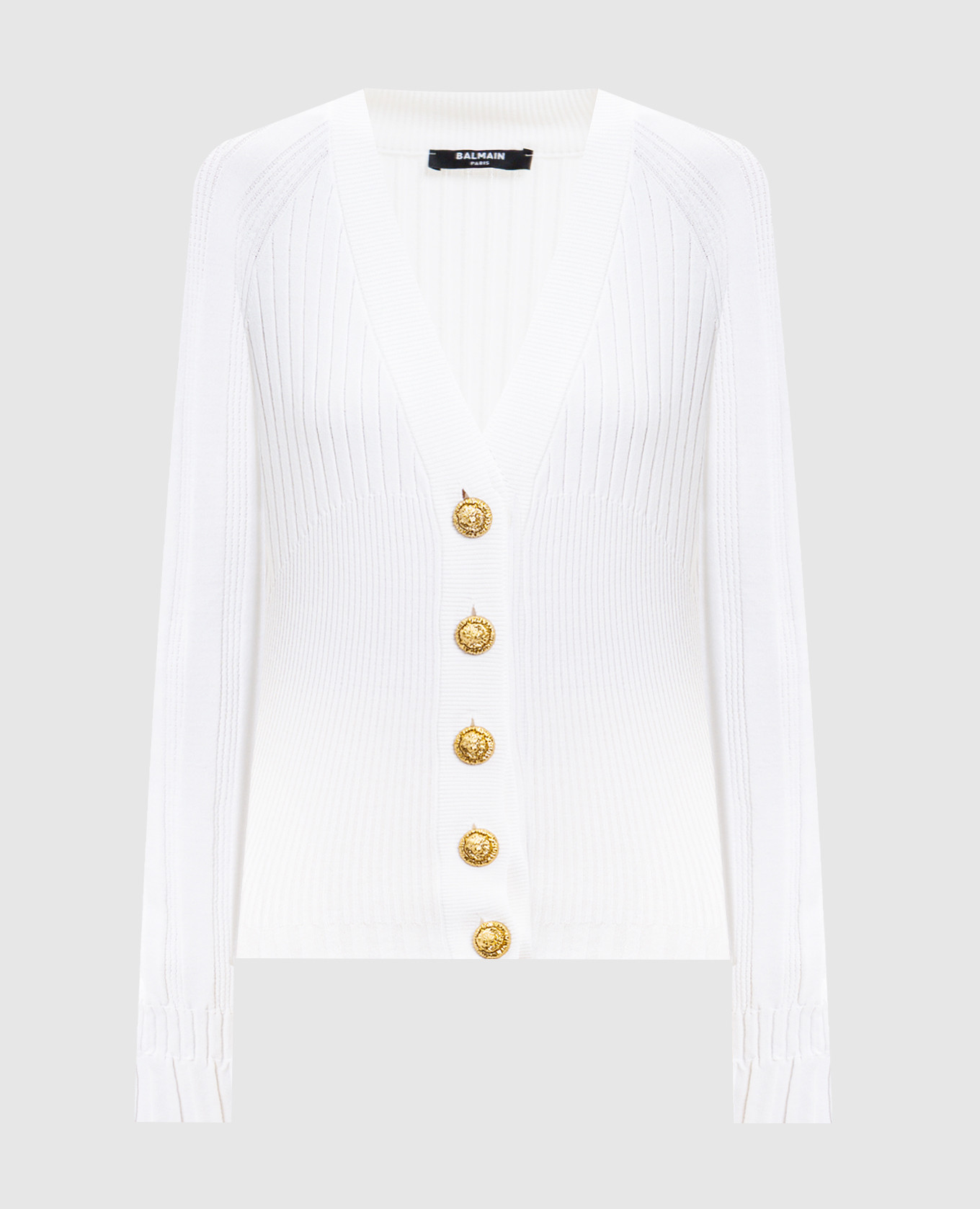 White cardigan with branded accessories